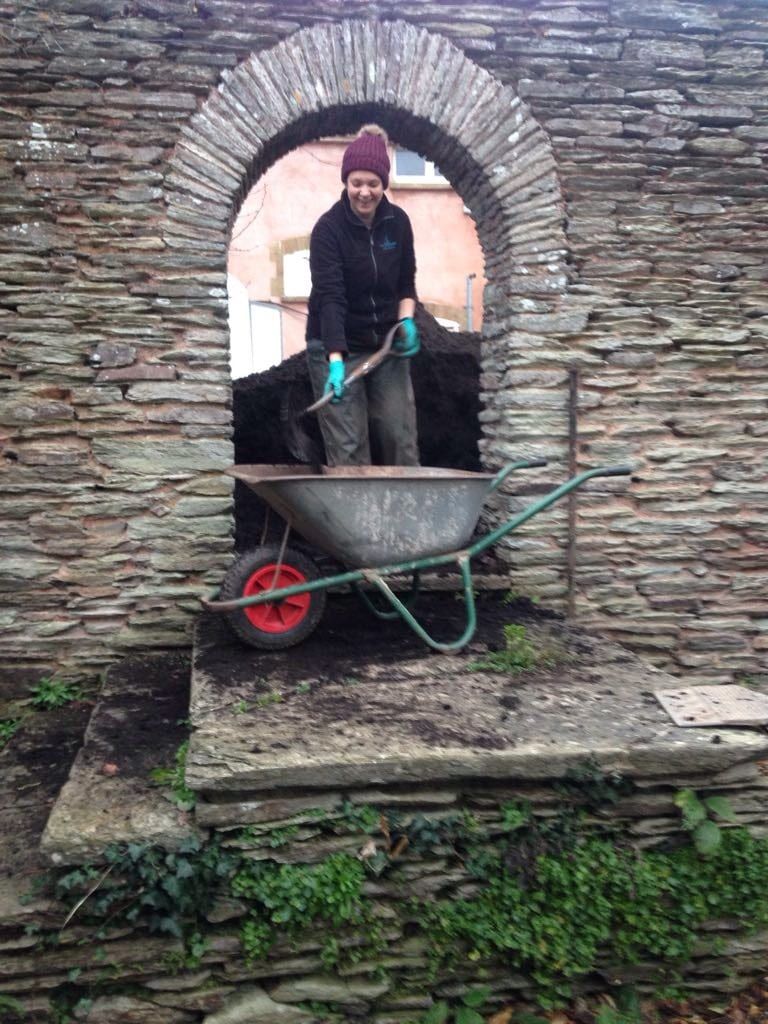 Gardener Kate preparing to mulch