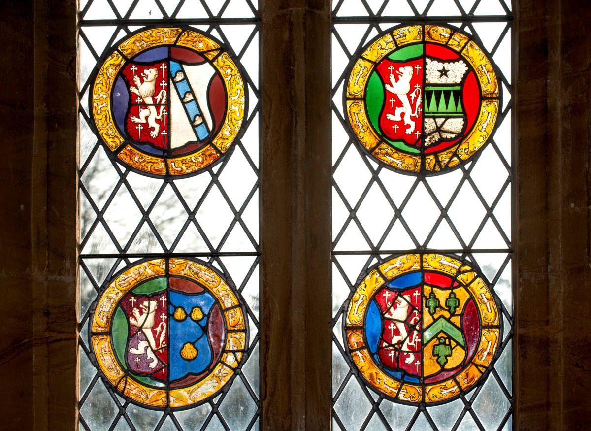 Fig. 2 - The four surviving Hestecombe chapel shields in the easternmost window of the south isle, Kingston St Mary church