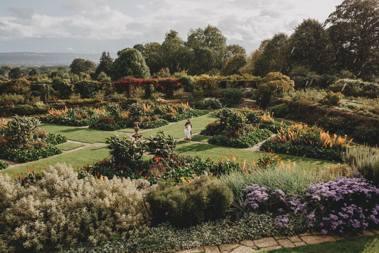 Wedding couple in the gardens at Taunton wedding venue, Hestercombe Gardens, on the Great Plat